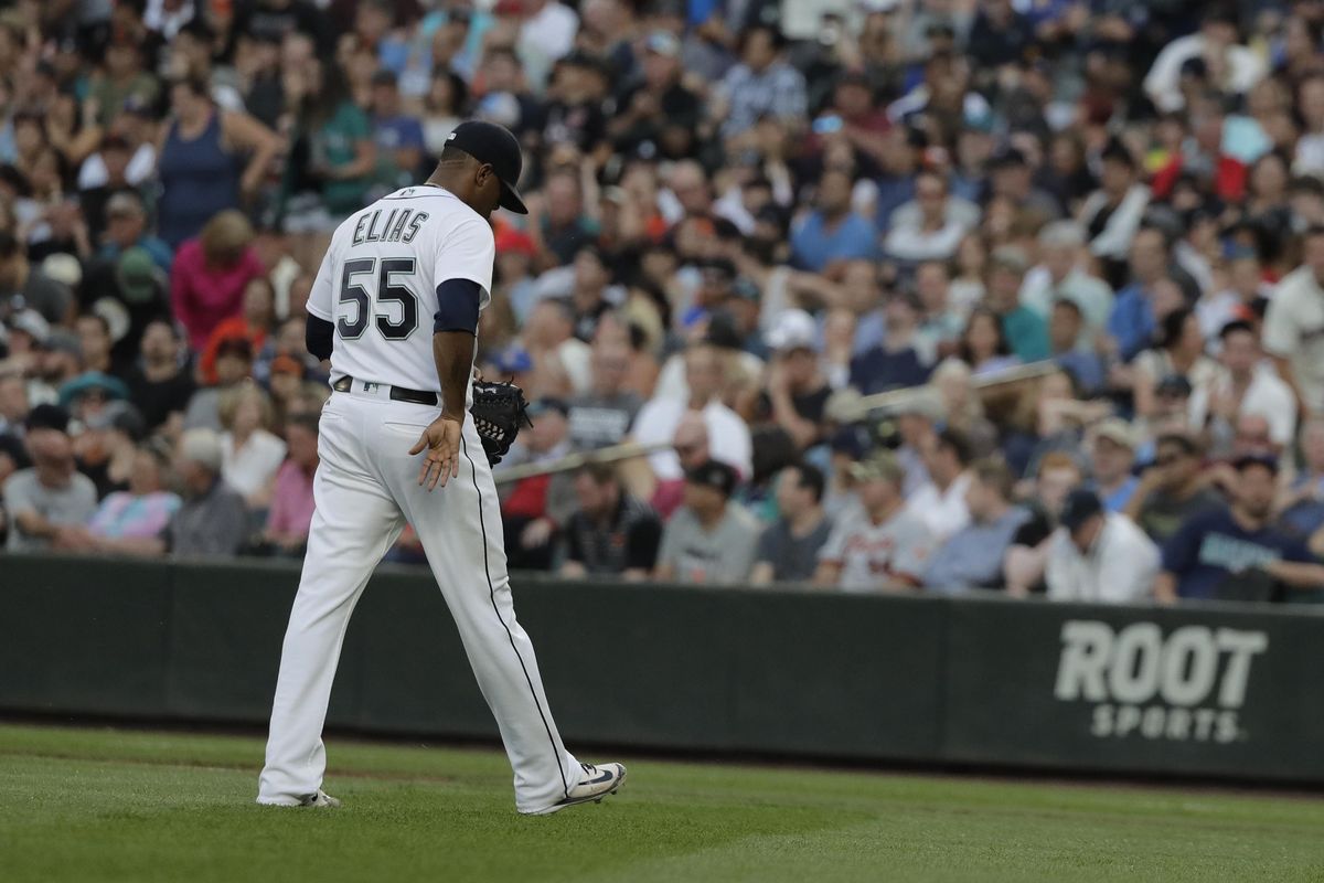 Seattle Mariners starting pitcher Roenis Elias walks to the dugout after he was pulled in the fourth inning of the team's baseball game against the San Francisco Giants, Tuesday, July 24, 2018, in Seattle. (Ted S. Warren / AP)