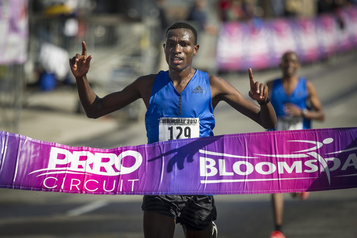 Gabriel Geay crosses the finish line to win the 2017 men’s Bloomsday race. (Colin Mulvany / The Spokesman-Review)