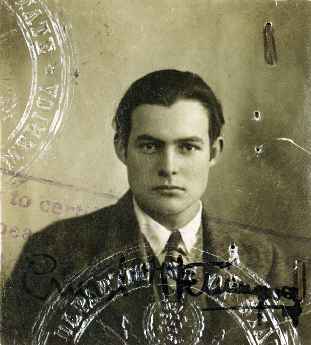 This 1920s photo provided by the John F. Kennedy Library Foundation from the Ernest Hemingway Collection shows Ernest Hemingway in his U.S. passport photo. A new three-part documentary about Hemingway, which relied heavily on the archives at the John F. Kennedy Presidential Library and Museum in Boston, debuts April 5, 2021, on PBS.  (HONS)