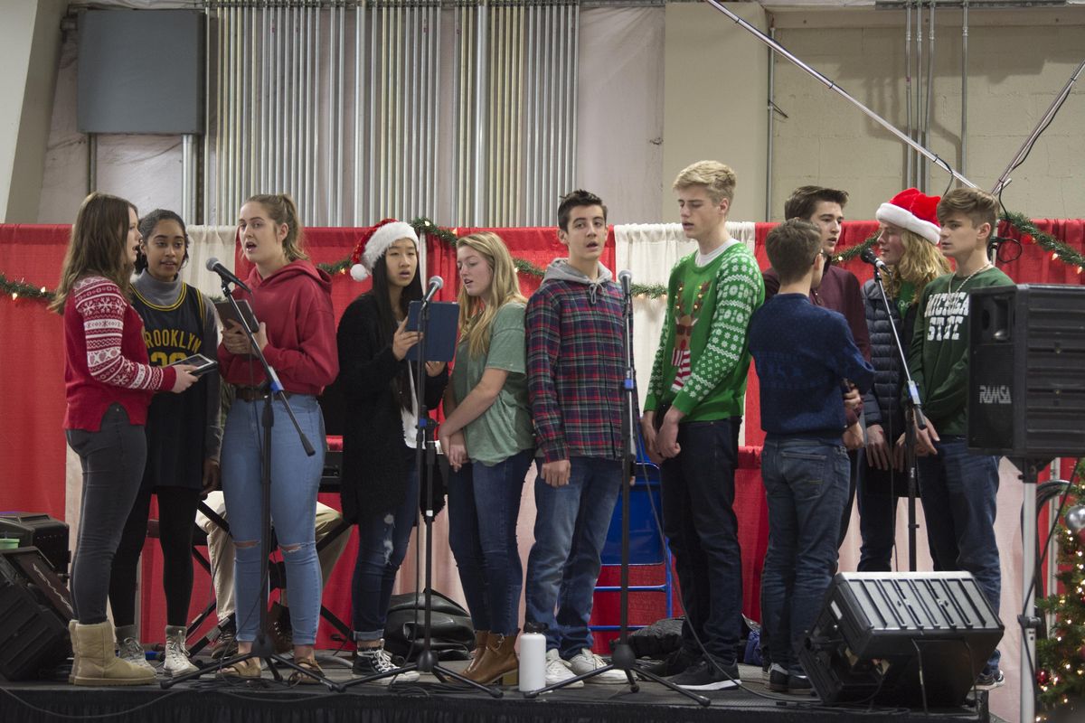 The jazz choir from Gonzaga Preparatory School entertains the people in line at the Christmas Bureau with Christmas music Wednesday, Dec. 13, 2017 at the Spokane County Fair and Expo Center. Jesse Tinsley/THE SPOKESMAN-REVIEW (Jesse Tinsley / The Spokesman-Review)