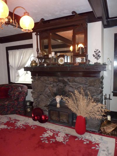 The fireplace in the living room of the Frederic Elmendorf House is built with river rock. The over-mantle piece was brought to the house by current owner Joan Butler. The house on East Ninth Avenue was built in 1903. (Stefanie Pettit / The Spokesman-Review)
