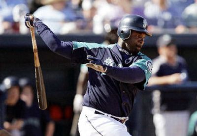 
Carl Everett, in his first year with the Seattle Mariners, has flashed occasional power while trying to increase his batting average and RBIs. 
 (Associated Press / The Spokesman-Review)