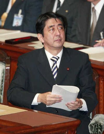 
Japanese Prime Minister Shinzo Abe, seen in Tokyo on Monday, has not specified a date when he'll step down. Associated Press
 (Associated Press / The Spokesman-Review)