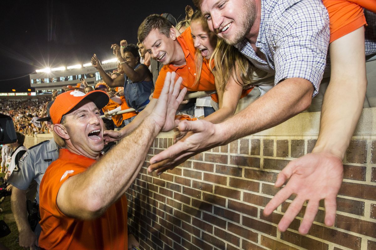 In this Saturday, Oct. 29, 2016, photo, Clemson coach Dabo Swinney celebrates the team’s 37-34 win over Florida State in an NCAA college football game in Tallahassee, Fla. Not many college football fans outside of Alabama and Ohio State are totally content with their coach. And contentment can be fleeting as Michigan State fans are finding out now. These days Clemson fans are crazy about Swinney and Stanford supporters are cool with David Shaw. (Mark Wallheiser / Associated Press)