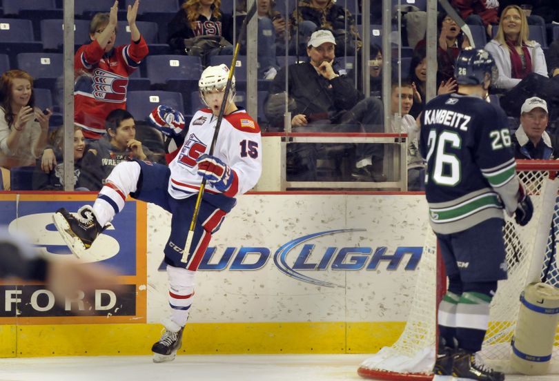 Spokane's Carter Proft pumps his fist after scoring the second goal against the Seattle Thunderbirds Wednesday, Mar. 6, 2013 at the Spokane Arena. (Jesse Tinsley / The Spokesman-Review)
