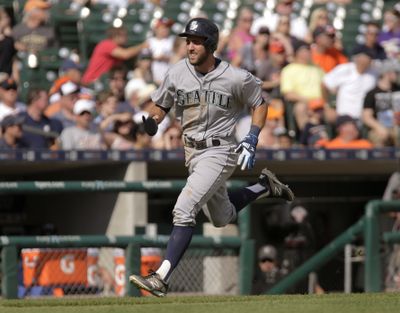Seattle Mariners' Chris Taylor scores from first base on a double by Mike Zunino to break a tie during the 12th inning Thursday in Detroit. The Mariners defeated the Tigers 3-2. (Associated Press)