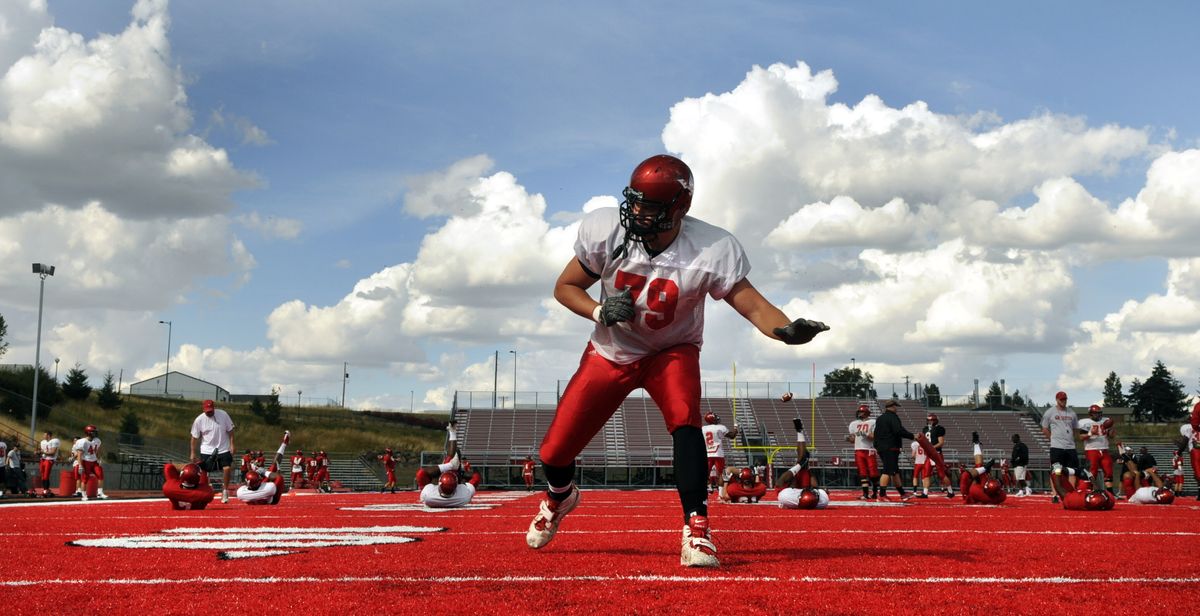 EWU lineman Brice Leahy fires out of his stance while limbering up before practice, September 14, 2010 at Roos Field in Cheney, Wash. Leahy was injured in a scooter accident 2 years ago and is battling back from a damaged leg. (Dan Pelle / The Spokesman-Review)