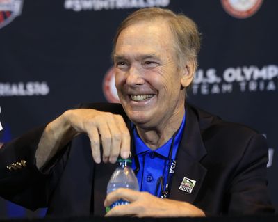 In this June 24, 2016, file photo, Chuck Wielgus, executive director of USA Swimming, smiles during a news conference at the U.S. Olympic team trials in Omaha, Neb. Wielgus is retiring after leading a federation that brought home more than 150 Olympic medals during his 20 years at the helm. Wielgus will leave his job Aug. 31. (Orlin Wagner / Associated Press)