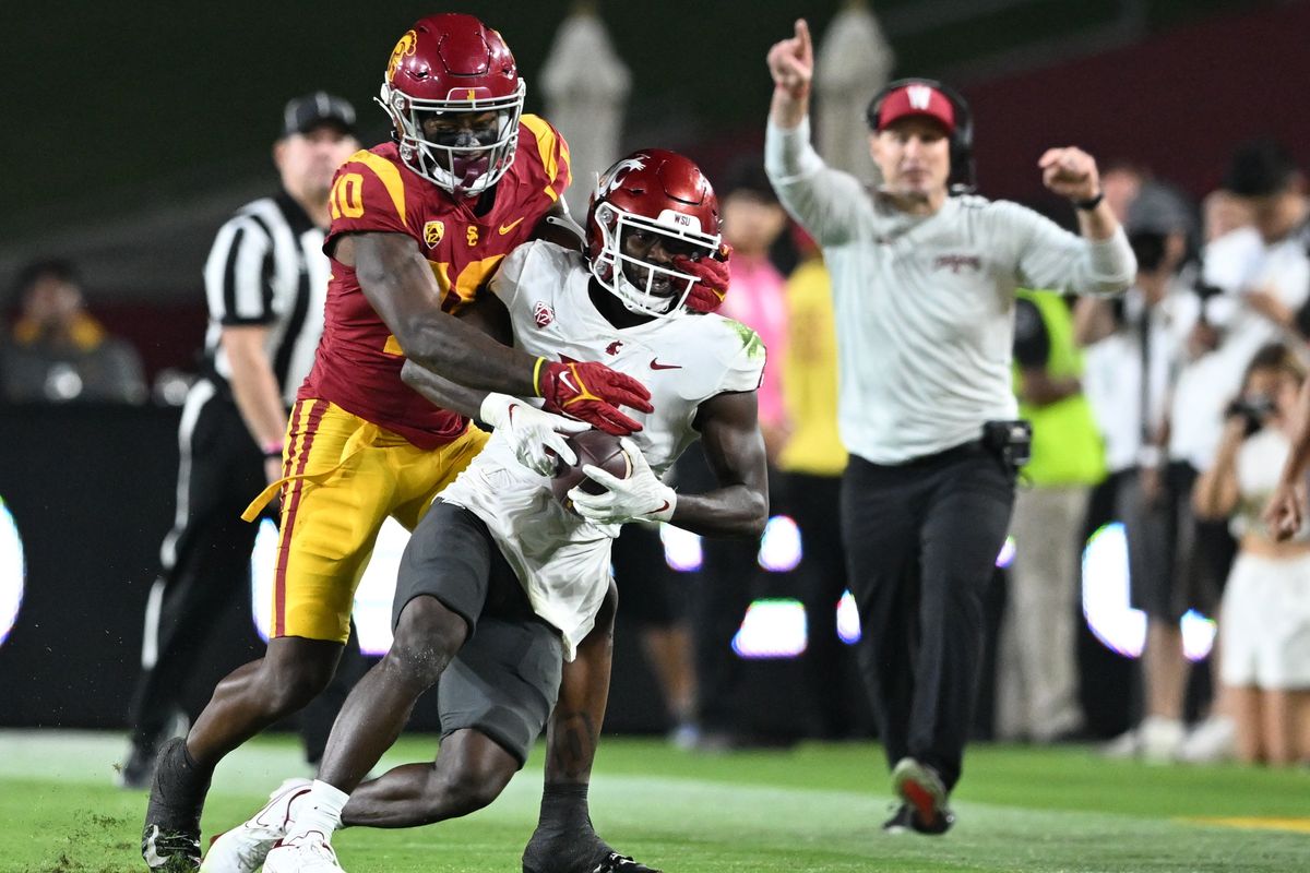 Washington State cornerback Chau Smith-Wade (6) intercepts a pass intended for USC wide receiver Kyron Hudson on a play that was overturned due to a penalty during the second half of a Pac-12 game on Saturday at Los Angeles Memorial Coliseum.  (Tyler Tjomsland/The Spokesman-Review)