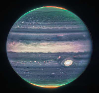Webb NIRCam composite image of Jupiter from three filters – F360M (red), F212N (yellow-green), and F150W2 (cyan) – and alignment due to the planet’s rotation.  (NASA, ESA, CSA, Jupiter ERS Team; image processing by Judy Schmidt)