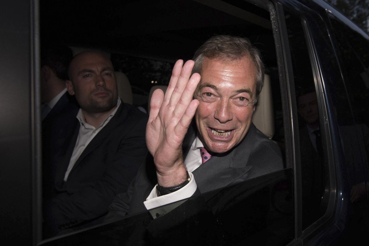 Nigel Farage, the leader of the UK Independence Party, celebrates Friday as he leaves a “Leave EU” organization party for the British European Union membership referendum in London. On Thursday, Britain voted in a national referendum on whether to stay inside the EU. (Stefan Rousseau / Associated Press)