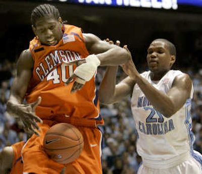 
Clemson's James Mays (40) and North Carolina's Deon Thompson battle for possession during the Tar Heels' 103-93 victory.Associated Press
 (Associated Press / The Spokesman-Review)