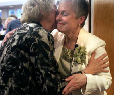 
The Rev. Marilyn Muehlbach embraces a parishioner after leading her last service.
 (The Spokesman-Review)