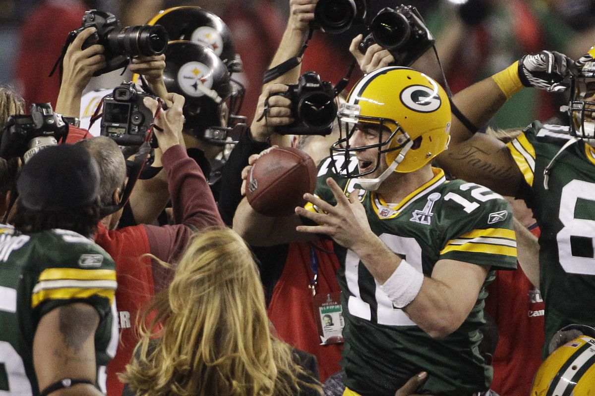 Aaron Rodgers celebrates with teammates after Green Bay’s victory over Pittsburgh in Super Bowl XLV.
