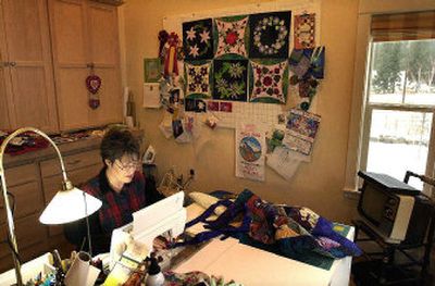 
Barbara Lambrecht works in the custom sewing room designed especially for her quilt-making.  
 (Brian Plonka / The Spokesman-Review)