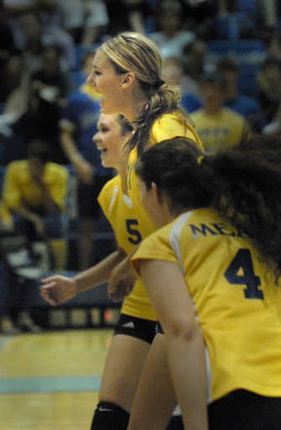 
From left, Meg Ryan, Alexis Olgard and Karyn Mockel rejoice over point scored against Central Valley Tuesday.
 (Brian Plonka / The Spokesman-Review)