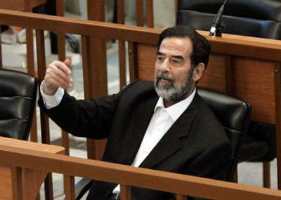 
Former Iraqi president Saddam Hussein speaks out in one of his many outbursts during closing defense arguments at his trial in the U.S.-controlled Green Zone in Baghdad, Iraq, on Wednesday. 
 (Associated Press / The Spokesman-Review)