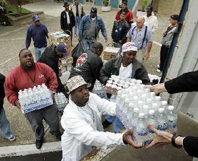 
Longshoremen at San Francisco's Fisherman's Wharf on Thursday load donated goods for victims of Hurricane Katrina.
 (Associated Press / The Spokesman-Review)