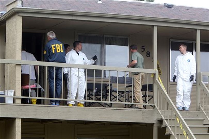 Federal authorities search an apartment in Boise, Idaho on Cassia Drive on Thursday afternoon, May 16 2013. U.S. authorities in Idaho said they have arrested a man from Uzbekistan accused of conspiring with a designated terrorist organization in his home country and helping scheme to use a weapon of mass destruction.  (AP/Idaho Statesman / Joe Jaszewski)