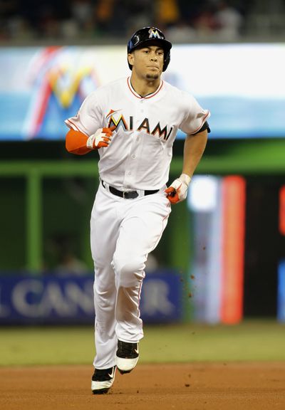 Miami’s Giancarlo Stanton will undergo knee surgery that will keep him out of the Marlins’ lineup for a while. (Associated Press)