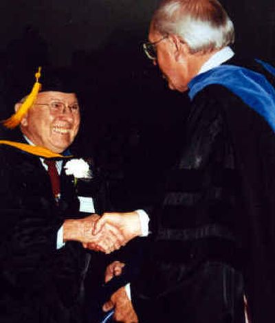 
Hugh Olin Smith, left, during a commencement ceremony at Lewis-Clark State College in May of 1991.
 (Family photos / The Spokesman-Review)