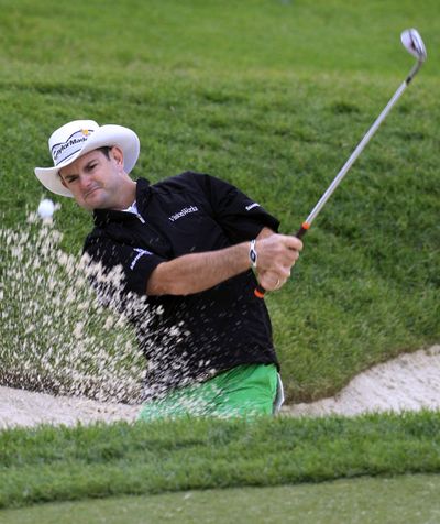 Rory Sabbatini hits out of the sand trap to the 16th green during Friday’s second round of the Memorial golf tournament. (Associated Press)