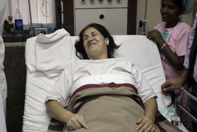 Linda Ragsdale, of Nashville, Tenn., a guest at the Oberoi Trident hotel who  who was shot in the shoulder and leg by terrorists, lies on a bed in a hospital in Mumbai, India, on Saturday.  (Associated Press / The Spokesman-Review)