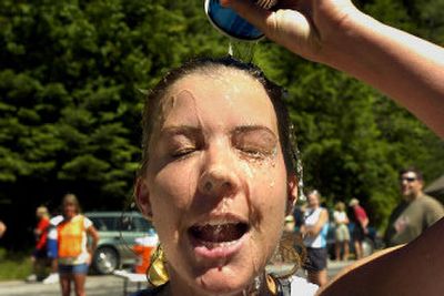 
Staci  Spencer, 30, cools down after running in the Let's Climb a Mountain race on Saturday. 
 (Jed Conklin / The Spokesman-Review)