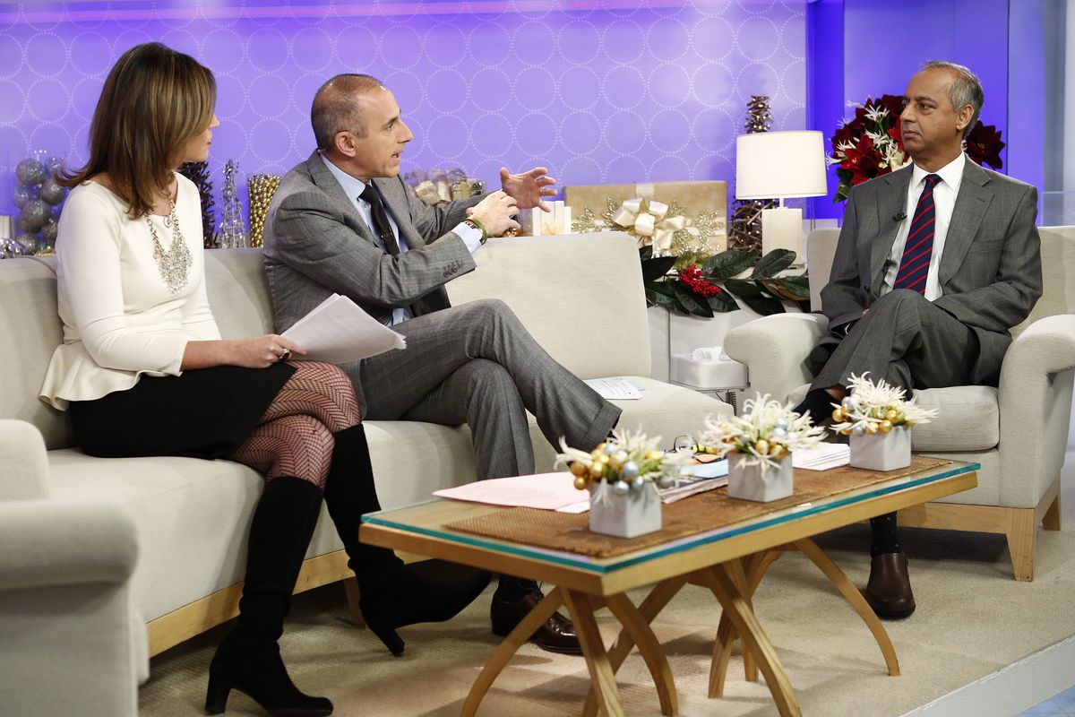 This image released by NBC shows co-hosts Savannah Guthrie, left, and Matt Lauer, center, during an interview with freelance photographer R. Umar Abbasi on NBC News
