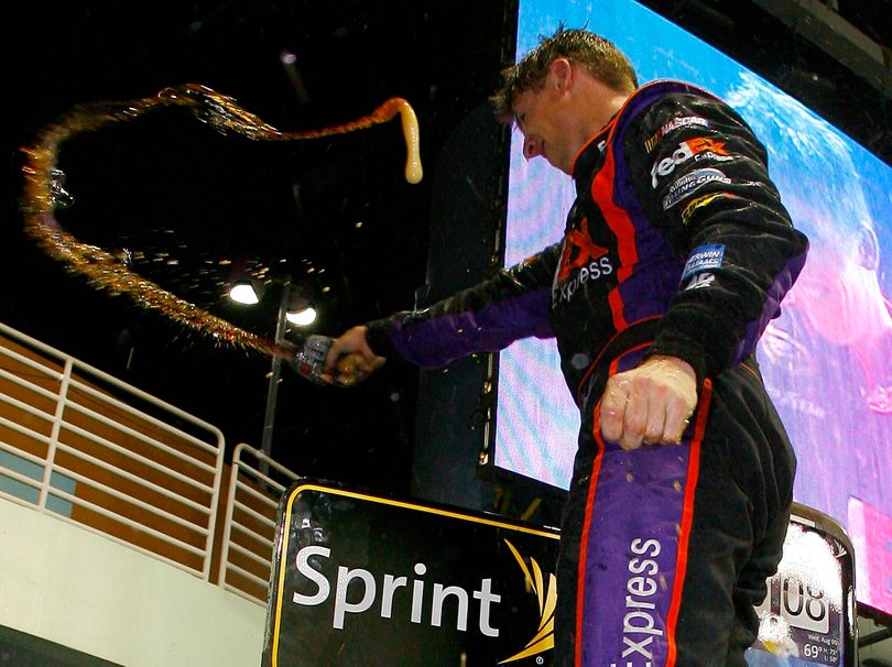 Denny Hamlin celebrates winning the Ford 400 at Homestead-Miami Speedway, his fourth victory of the season. (Photo Credit: Jason Smith/Getty Images for NASCAR) (Jason Smith / Getty Images North America)