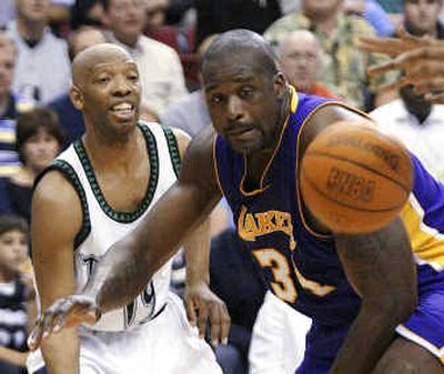 Lakers' Shaquille O'Neal, right, can't quite catch up to a pass by Timberwolves' Sam Cassell on Friday night. Lakers' Shaquille O'Neal, right, can't quite catch up to a pass by Timberwolves' Sam Cassell on Friday night. 
 (Associated PressAssociated Press / The Spokesman-Review)