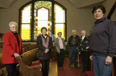 
Rathdrum/Westwood Historical Society members, from left, Patti McElroy, Marilyn Wagenius, Beth Holcomb, Sid Penman, Virginia Penman and Ellen Larsen stand in the sanctuary of the Methodist Church in Rathdrum, which the society hopes to preserve.  
 (Jesse Tinsley / The Spokesman-Review)