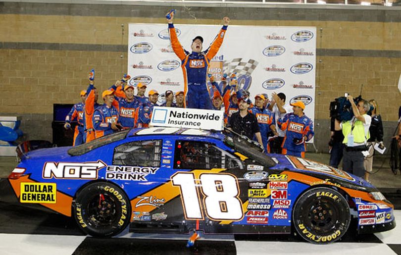 Kyle Busch celebrates winning the NASCAR Nationwide Series Federated Auto Parts 300 on Saturday at Nashville Superspeedway. (Photo by Chris Graythen/Getty Images) (Chris Graythen / The Spokesman-Review)