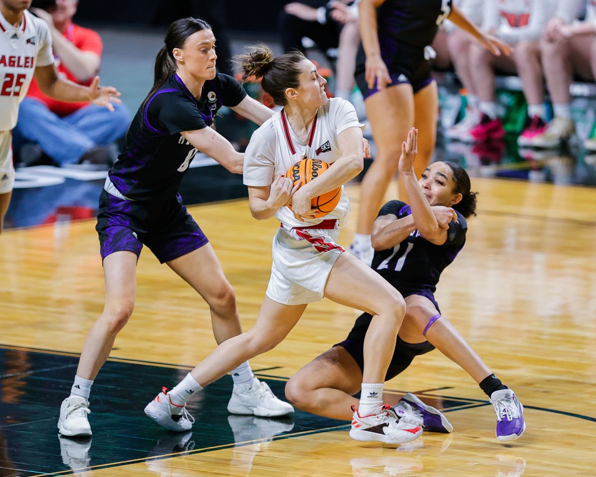 Eastern Washington Eagles guard Jamie Loera protects the ball against Weber State Wildcats’ Laura Taylor, left, and Daryn Hickok on Sunday in Boise.  (Steve Conner/For The Spokesman-Review)