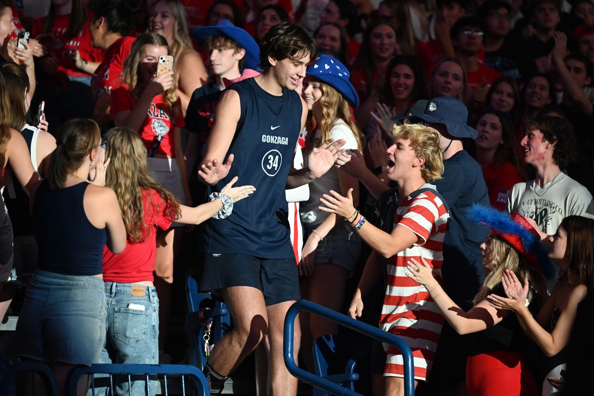 Gonzaga’s Braden Huff makes his way through the crowd Saturday during player introductions at Kraziness in the Kennel.  (By Jesse Tinsley/The Spokesman-Review)
