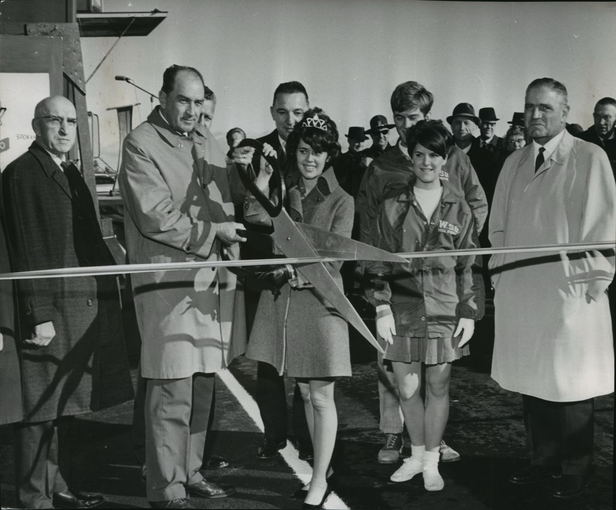 Participating in a ribbon-cutting ceremony in 1968 are, from left, State Sen. Elmer C. Huntley, Charles G. Prahl, state highway director; Miss Washington Highways, Jeannine Gill; WSU cheerleaders Bruce Buskirk, Priss O