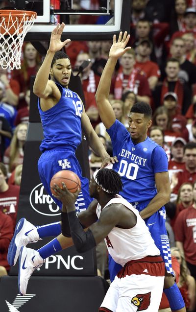 Kentucky's Karl-Anthony Towns, top left, and Marcus Lee, top right, contest a shot by Louisville's Montrezl Harrell. (Associated Press)