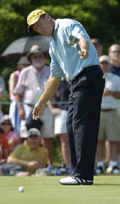 
Fred Funk coaxes his putt on the sixth hole during third round play in the US Open at Shinnecock Hills Golf Club Saturday. Funk parred the hole.
 (Associated Press / The Spokesman-Review)