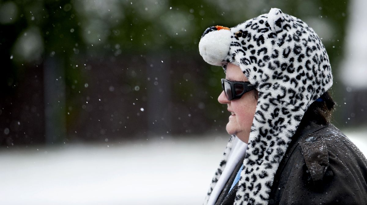 “I just love these crazy things,” Ruthie Taylor said about her animal hat as she walked through the snow Monday in Post Falls. (Kathy Plonka)