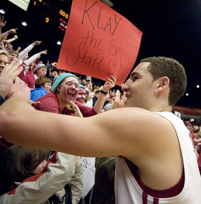 Washington State guard Klay Thompson  shakes hand with the student section crowd after a NIT quarterfinal game against Northwestern on Wednesday, March 23, 2011, in Pullman. (Dean Hare / AP)
