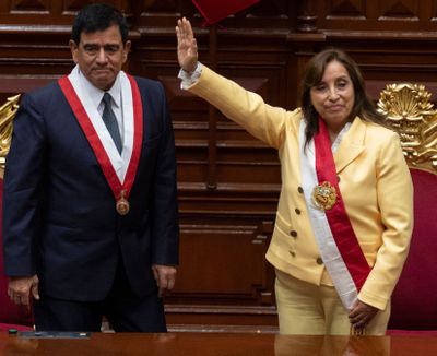 President of the Peruvian Congress Jose Williams Zapata (L) stands next to Dina Boluarte (R) after swearing her in as the new President hours after former President Pedro Castillo was impeached in Lima, on December 7, 2022. - Peru's Pedro Castillo was impeached and replaced as president by his deputy on Wednesday in a dizzying series of events in the country that has long been prone to political upheaval. Dina Boluarte, a 60-year-old lawyer, was sworn in as Peru's first female president just hours after Castillo tried to wrest control of the legislature in a move criticized as an attempted coup.    (CRIS BOURONCLE/AFP via Getty Images/TNS)