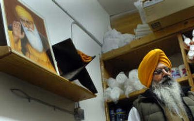 Dharamjit Khehra, manager of Piggie's Deli and Market in Coeur d'Alene, talks Monday about the racist note left at the market on Thursday.
(Kathy Plonka / The Spokesman-Review)