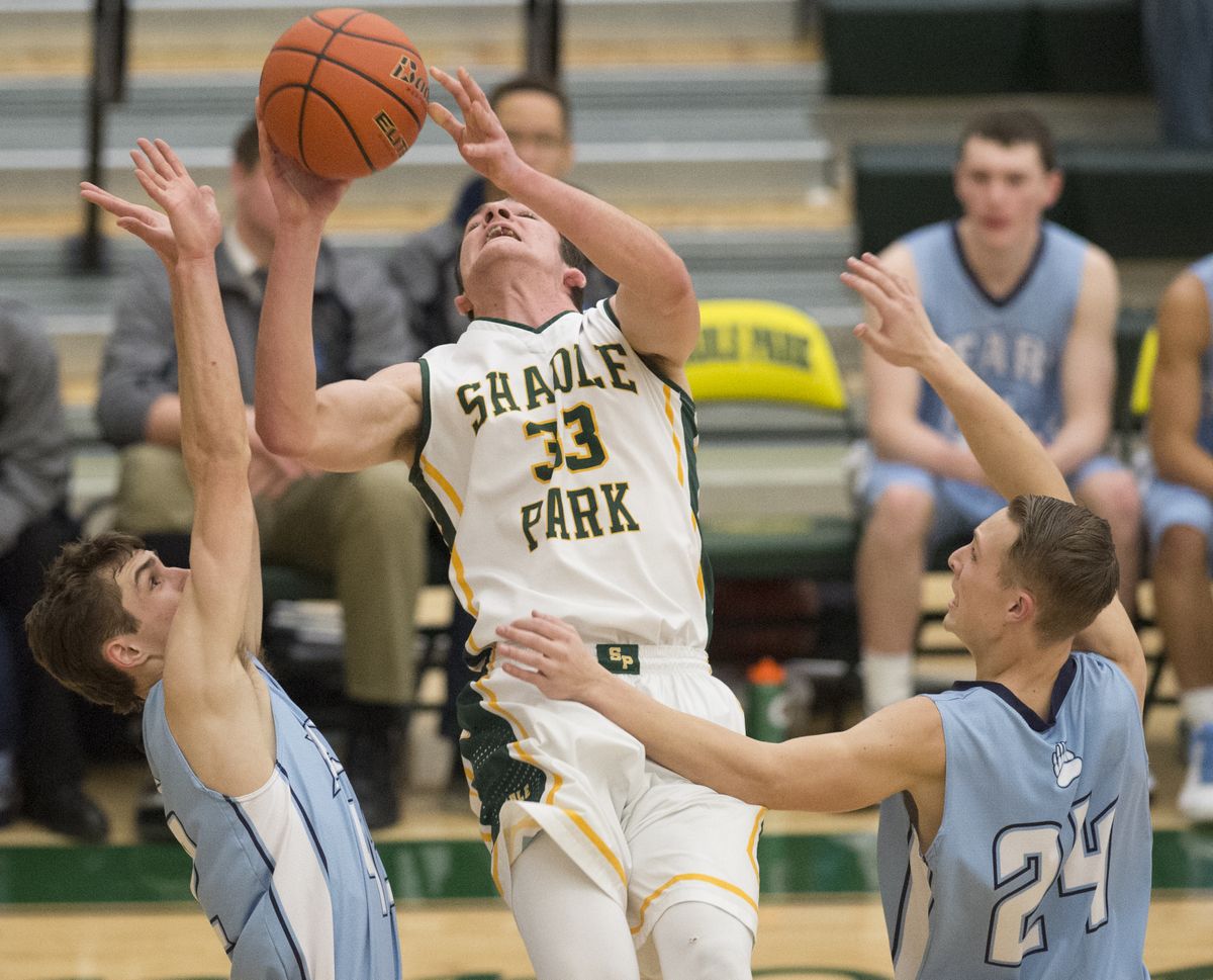 Highlanders’ Sam Stratton fights against Central Valley’s defense during Friday’s GSL play at Shadle Park. (TYLER TJOMSLAND PHOTOS)