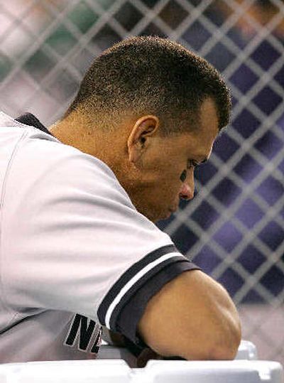 
Yankees third baseman Alex Rodriguez hangs his head in the dugout Saturday. 
 (Associated Press / The Spokesman-Review)