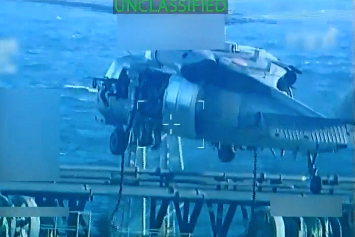 U.S. forces fast rope onto an oil tanker during a raid described by U.S. Attorney General Pam Bondi as its seizure by the United States off the coast of Venezuela, December 10, 2025, in a still image from video.   (U.S. Attorney General/Handout)