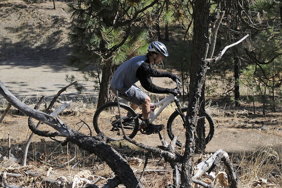 Peter Jantz descends the biking trails in Camp Sekani Park on Oct. 7. Jantz is a caretaker at the park. (Dan Pelle / The Spokesman-Review)