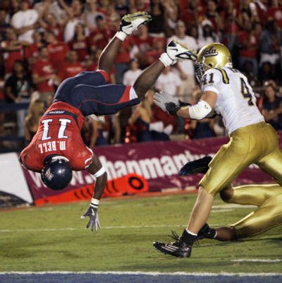 
Pac-10 fortunes flip-flopped last Saturday when Mike Bell's Arizona Wildcats humbled UCLA and Spencer Havner, right. 
 (Associated Press / The Spokesman-Review)