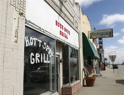 The closed Hott Spot Grill, along with a couple of other businesses that remain on Main Street, is seen in downtown Hugo, Colo., on Feb. 24.  (Associated Press file)