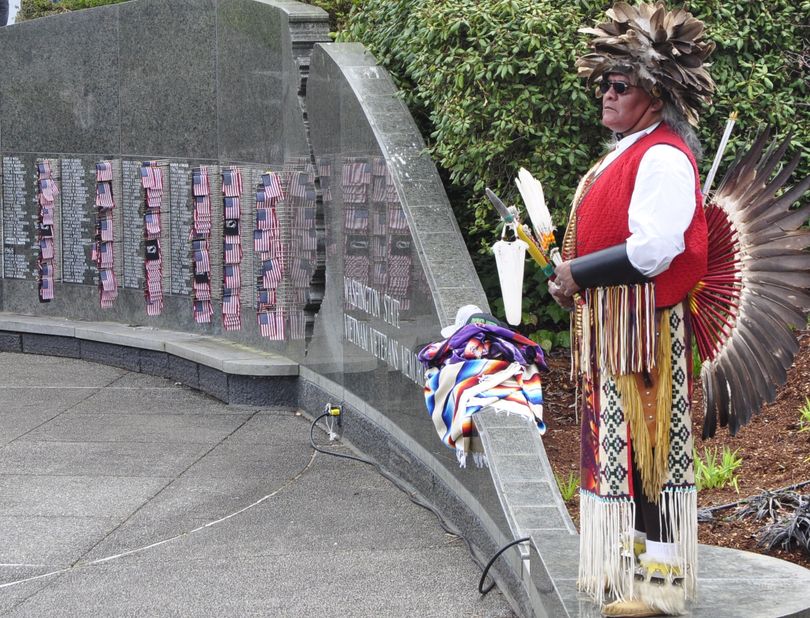 OLYMPIA -- Leeman Able, a member of the Shoshone Paiute tribe, stands at the Washington State Vietnam Memorial Friday during a ceremony marking 