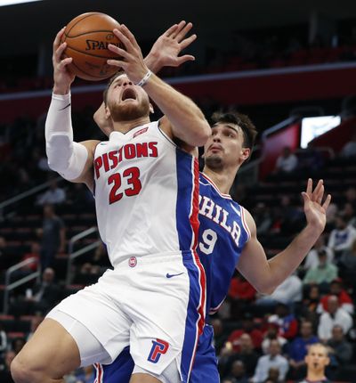 Detroit Pistons forward Blake Griffin (23) shoots as Philadelphia 76ers forward Dario Saric (9) defends during the first half of an NBA basketball game, Tuesday, Oct. 23, 2018, in Detroit. (Carlos Osorio / Associated Press)